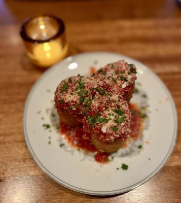 Gabbiano’s signature dishes Dorinda’s Famous Garlic KnotsCaesar Salad (prepared tableside)Pork Chop Parmigiana